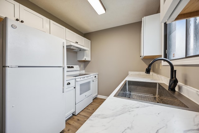 kitchen featuring sink, light hardwood / wood-style flooring, a textured ceiling, white appliances, and white cabinets