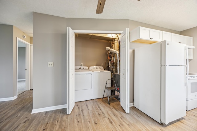 laundry room with ceiling fan, light hardwood / wood-style floors, separate washer and dryer, and a textured ceiling