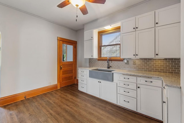 kitchen featuring white cabinetry, sink, ceiling fan, and dark wood-type flooring