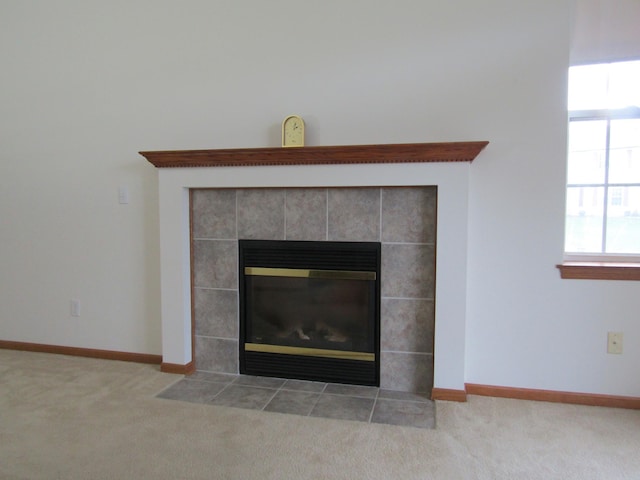 room details with carpet flooring and a tile fireplace