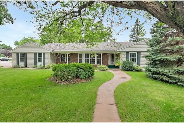 ranch-style house with a front lawn