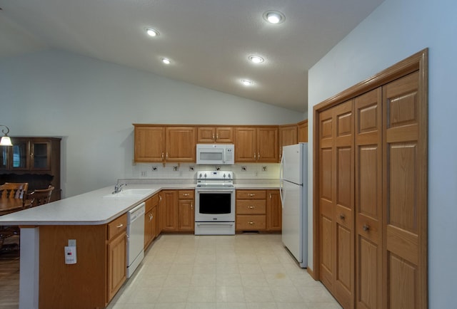 kitchen with sink, backsplash, kitchen peninsula, vaulted ceiling, and white appliances