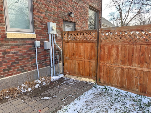 view of snow covered gate