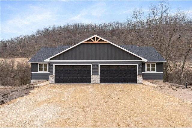 S1546 Shawnee Dr Unit B, Alma, WI 54610 - view of front facade with an attached garage and dirt driveway