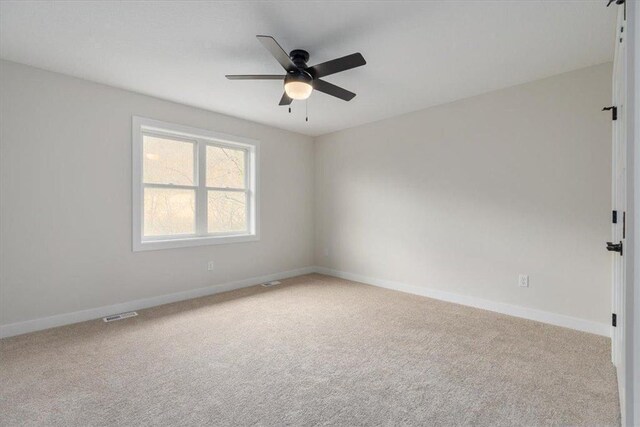 S1546 Shawnee Dr Unit B, Alma, WI 54610 - unfurnished room with carpet flooring, baseboards, and ceiling fan