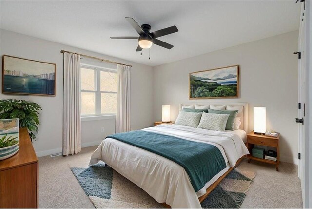 S1546 Shawnee Dr Unit B, Alma, WI 54610 - bedroom with light colored carpet, a ceiling fan, and baseboards