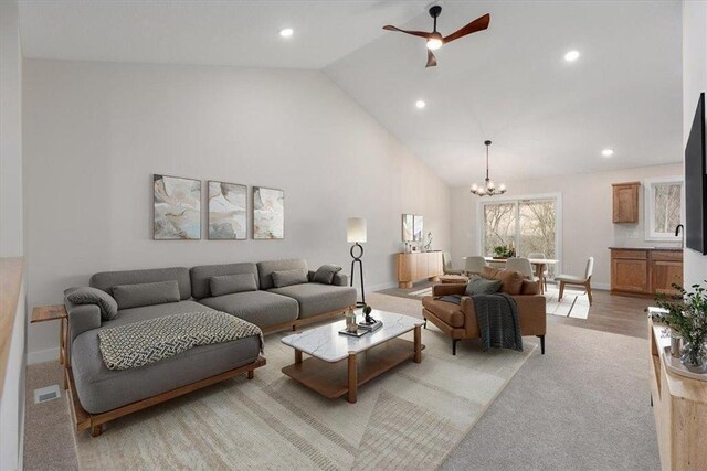 S1546 Shawnee Dr Unit B, Alma, WI 54610 - living area featuring a chandelier, recessed lighting, baseboards, a ceiling fan, and high vaulted ceiling