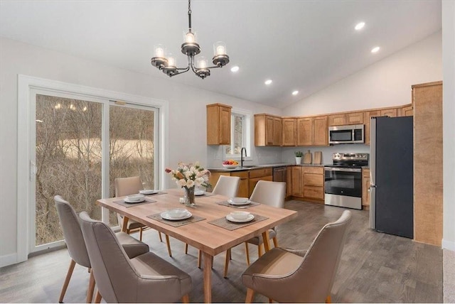 S1546 Shawnee Dr Unit B, Alma, WI 54610 - dining room featuring a chandelier, wood finished floors, recessed lighting, and high vaulted ceiling