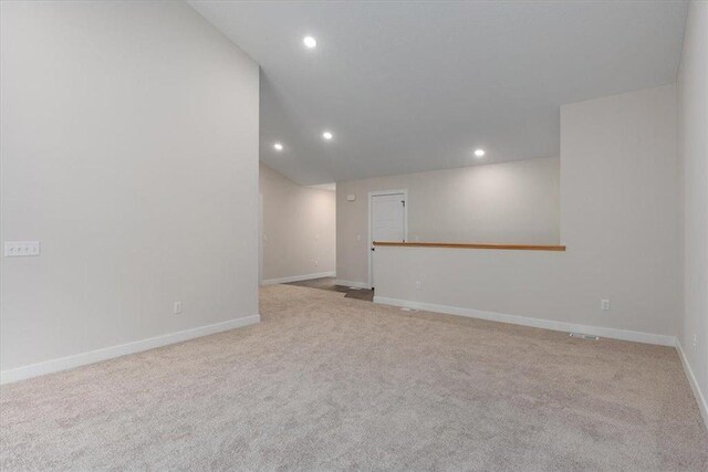 S1546 Shawnee Dr Unit B, Alma, WI 54610 - carpeted empty room with recessed lighting, baseboards, and vaulted ceiling
