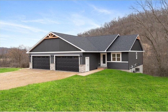 S1546 Shawnee Dr Unit B, Alma, WI 54610 - view of front facade featuring driveway, a front yard, a garage, a shingled roof, and central air condition unit