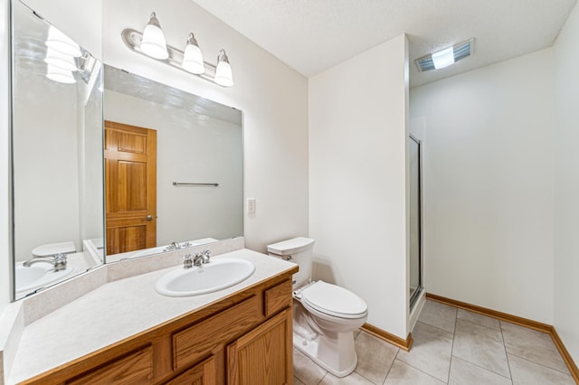 bathroom featuring visible vents, toilet, a shower stall, tile patterned flooring, and vanity