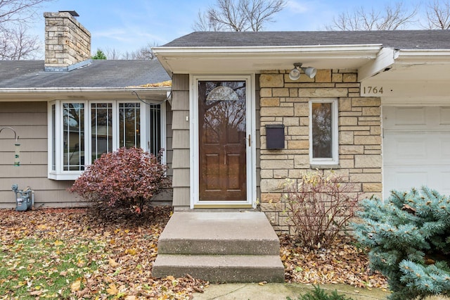 entrance to property featuring a garage