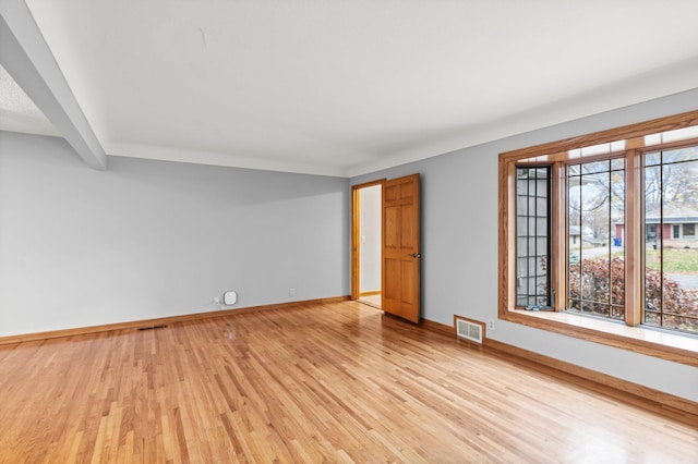 spare room with light hardwood / wood-style floors