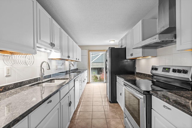 kitchen with white cabinets, sink, wall chimney exhaust hood, and stainless steel appliances