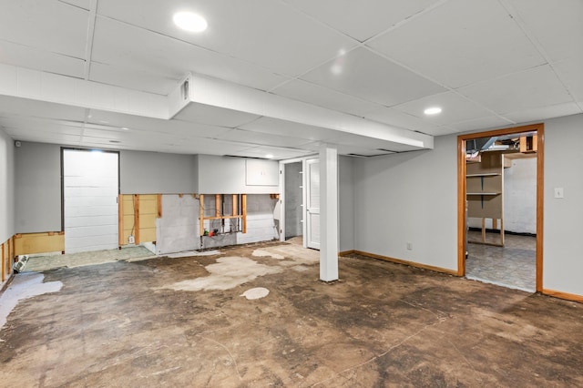 basement featuring a paneled ceiling