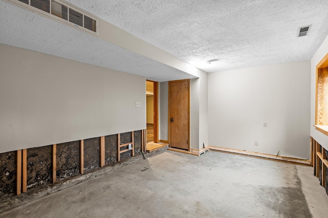 basement with a textured ceiling