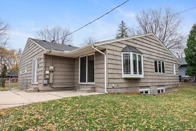 exterior space with a lawn and a patio