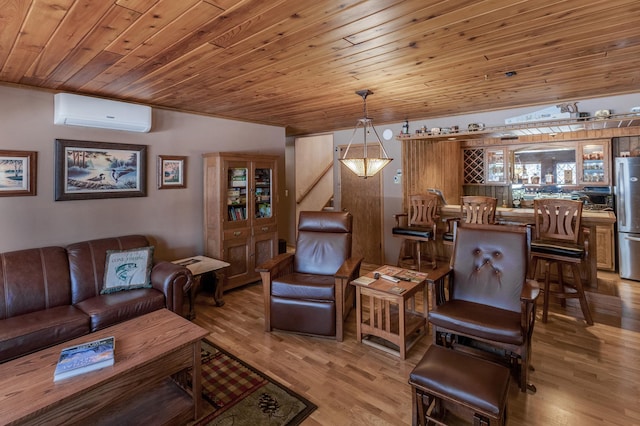 living area with wood ceiling, a wall unit AC, and wood finished floors