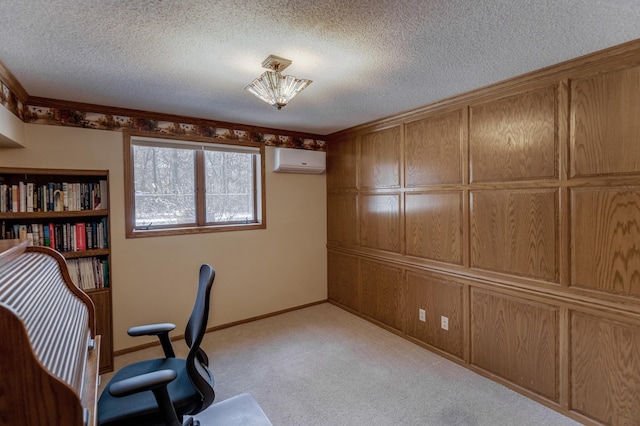 unfurnished office featuring light colored carpet, a textured ceiling, a wall mounted air conditioner, and baseboards