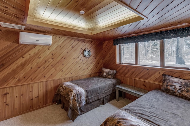 carpeted bedroom with wood ceiling, wood walls, and a wall mounted air conditioner