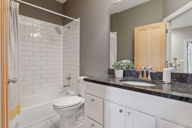 full bathroom featuring tile patterned flooring, shower / bath combination with curtain, vanity, and toilet