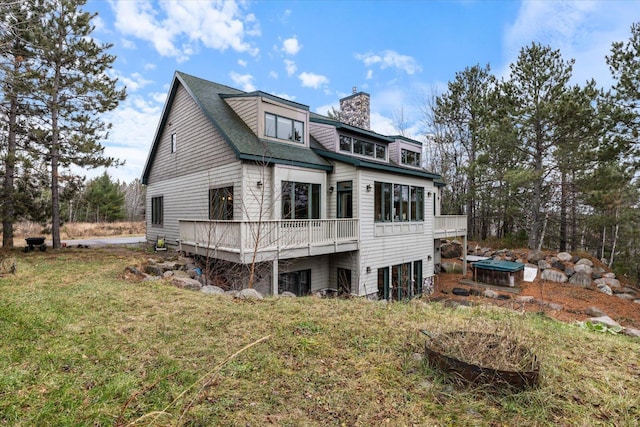 exterior space with a yard and a deck