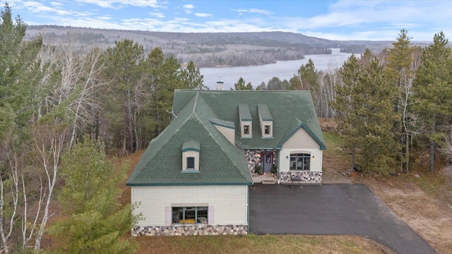 view of front facade with a water and mountain view