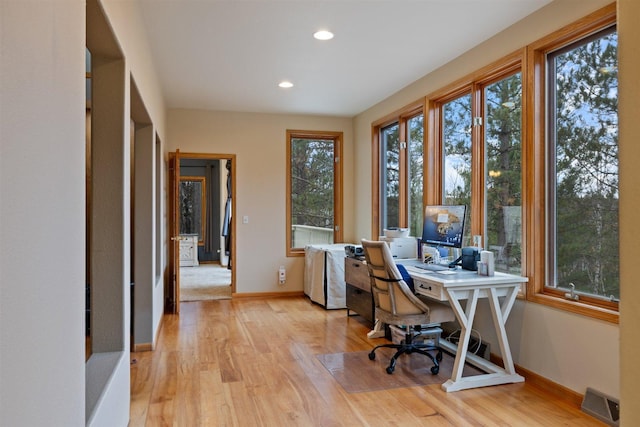 office space featuring light hardwood / wood-style flooring and plenty of natural light