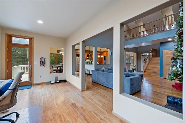 home office with a chandelier and wood-type flooring