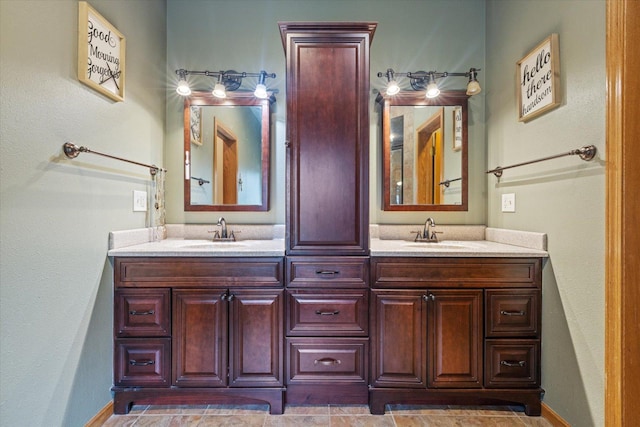 bathroom with tile patterned floors and vanity