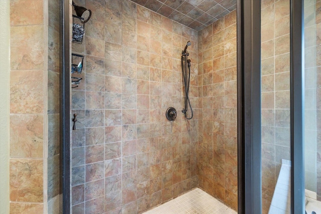 bathroom with tiled shower