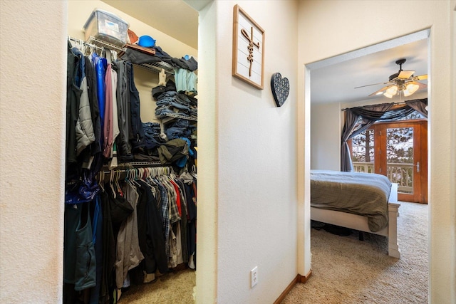 interior space with ceiling fan and carpet floors