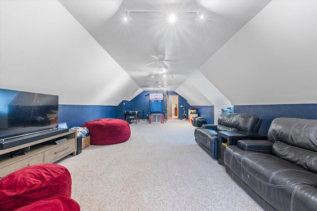 living room with carpet floors, vaulted ceiling, and ceiling fan