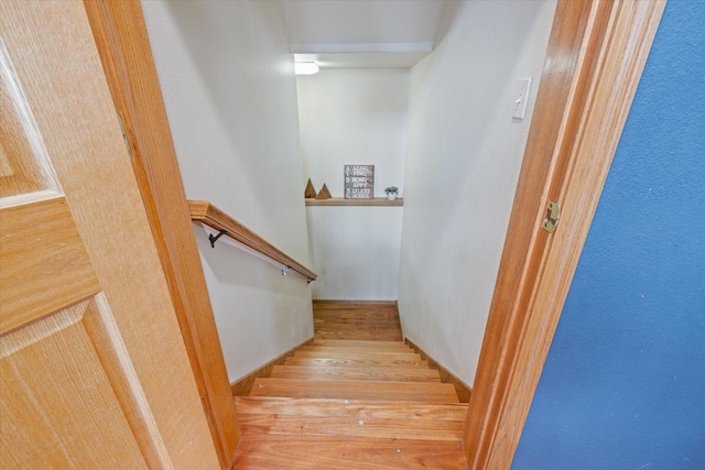 stairs with hardwood / wood-style flooring