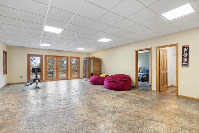 basement featuring a paneled ceiling