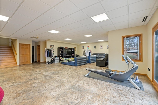 workout room with a paneled ceiling