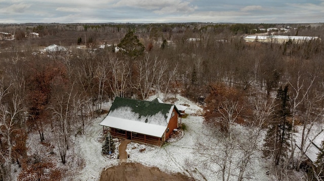 aerial view featuring a wooded view