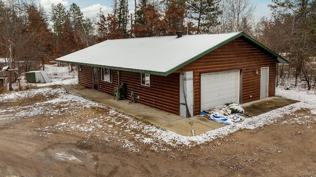 view of snow covered garage