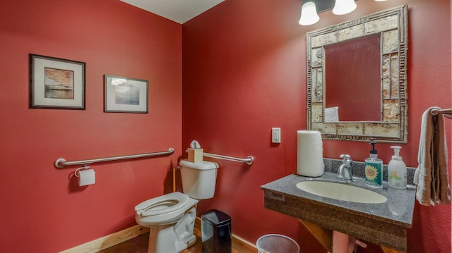 bathroom featuring toilet and sink