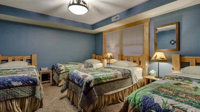 bedroom with carpet and visible vents