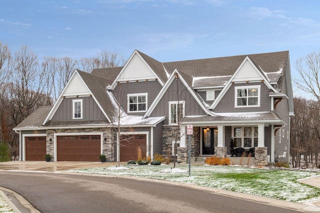 craftsman-style house featuring a porch and a garage