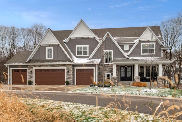 view of front of house with french doors and a garage