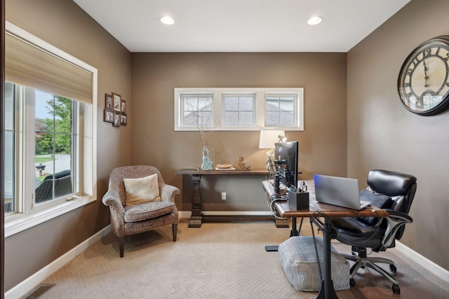 carpeted home office featuring plenty of natural light