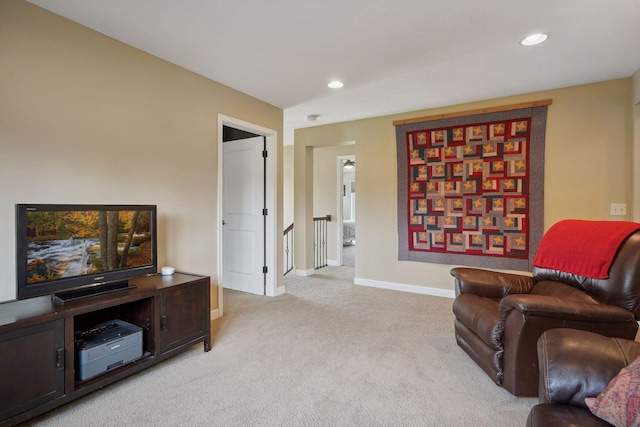 sitting room featuring light colored carpet