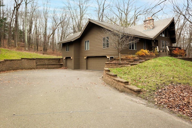 view of side of property with a garage