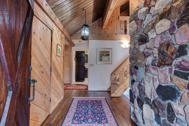 hall featuring wood walls, high vaulted ceiling, wood ceiling, and dark hardwood / wood-style floors