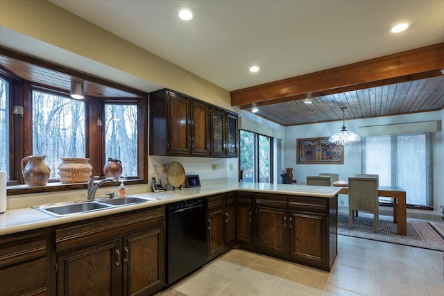 kitchen with pendant lighting, dishwasher, a healthy amount of sunlight, and sink