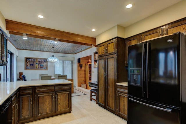 kitchen featuring dark brown cabinetry, black appliances, beam ceiling, decorative light fixtures, and an inviting chandelier