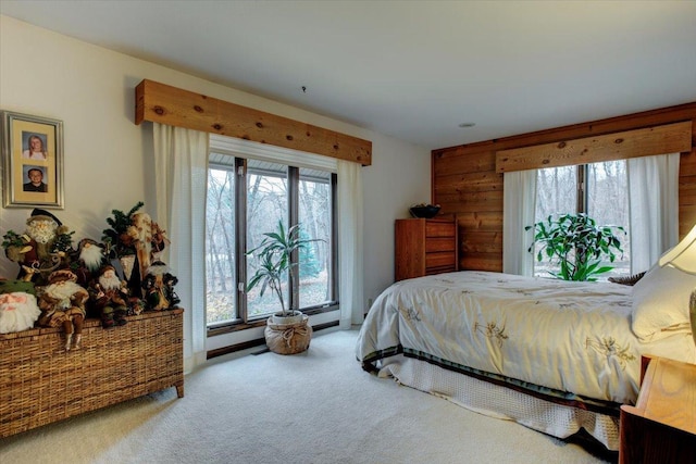 bedroom featuring multiple windows and carpet