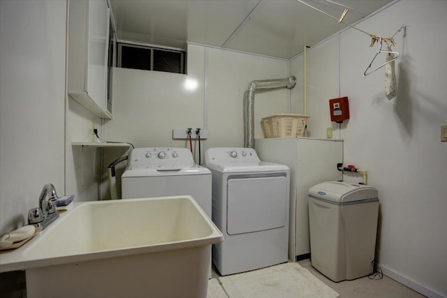 laundry room with independent washer and dryer and sink